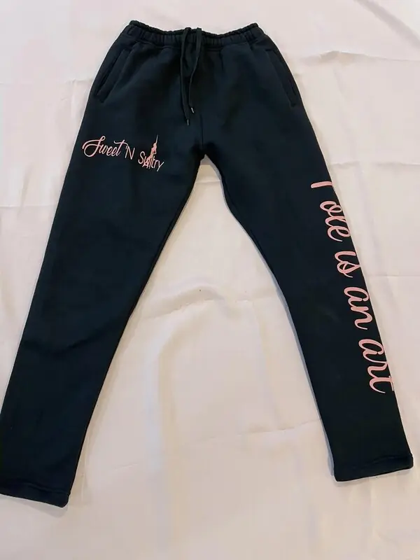Black SNS sweatpants printed Pole is an art down the leg